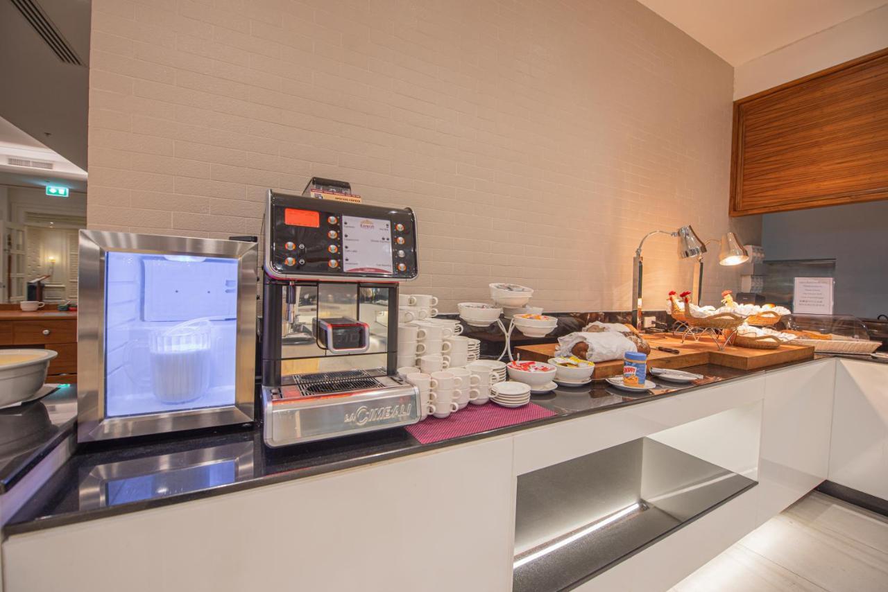 The Empress Premier Chiang Mai - Sha Extra Plus Экстерьер фото A coffee machine in a hotel